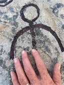 picture on a rock with hand